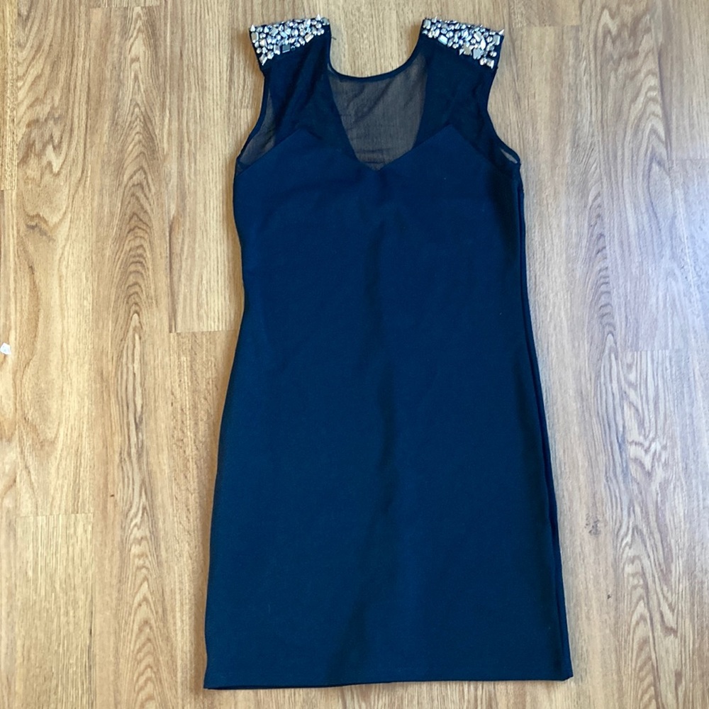 Little black dress with spiked sleeves
